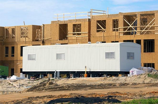 crane lifting modular building for construction office rentals in Hawaiian Gardens